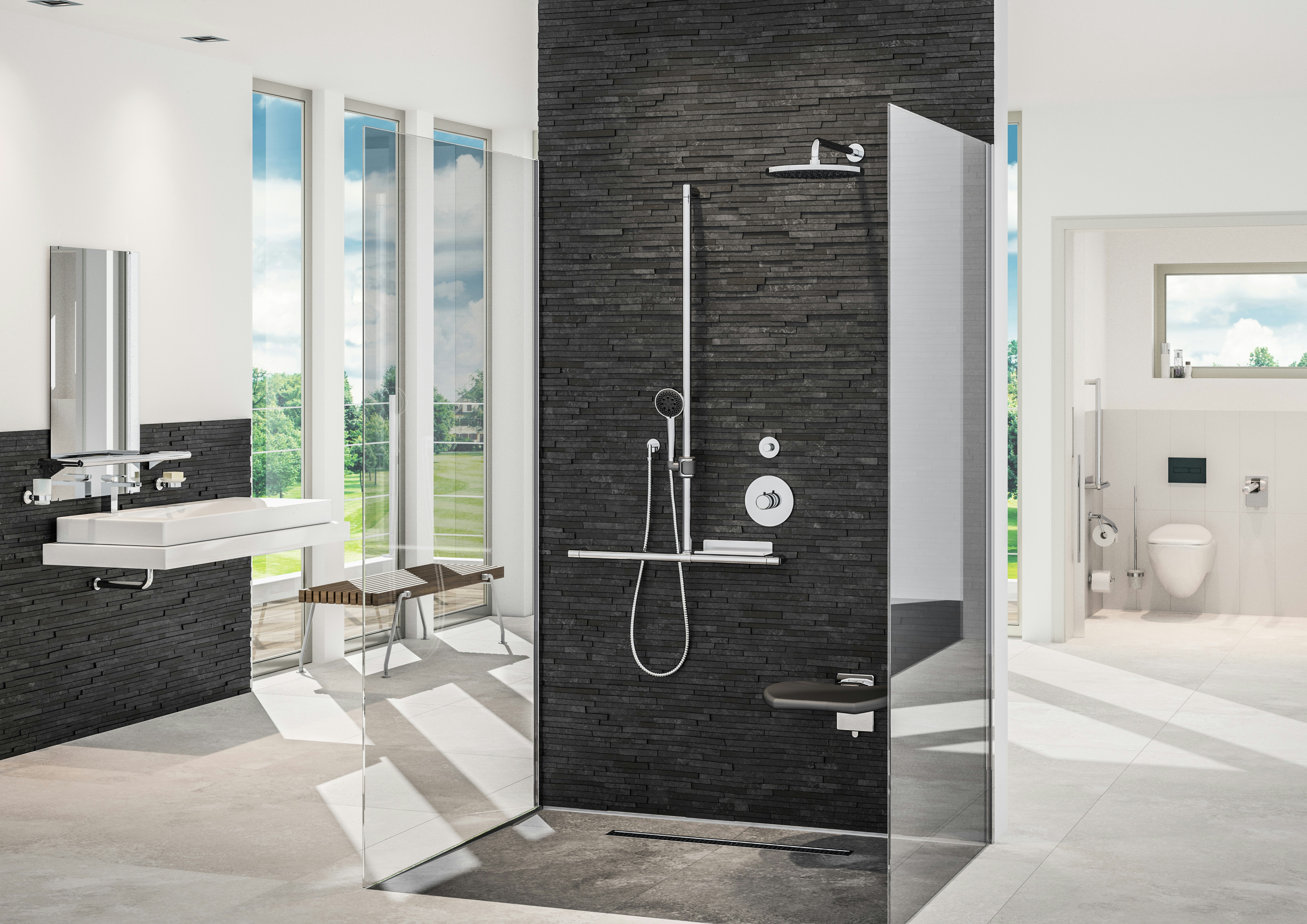 Modulare Fahrradbarriere aus Metall in Schwarz-Grau am urbanen Uferweg, mit Fahrrad-Symbol