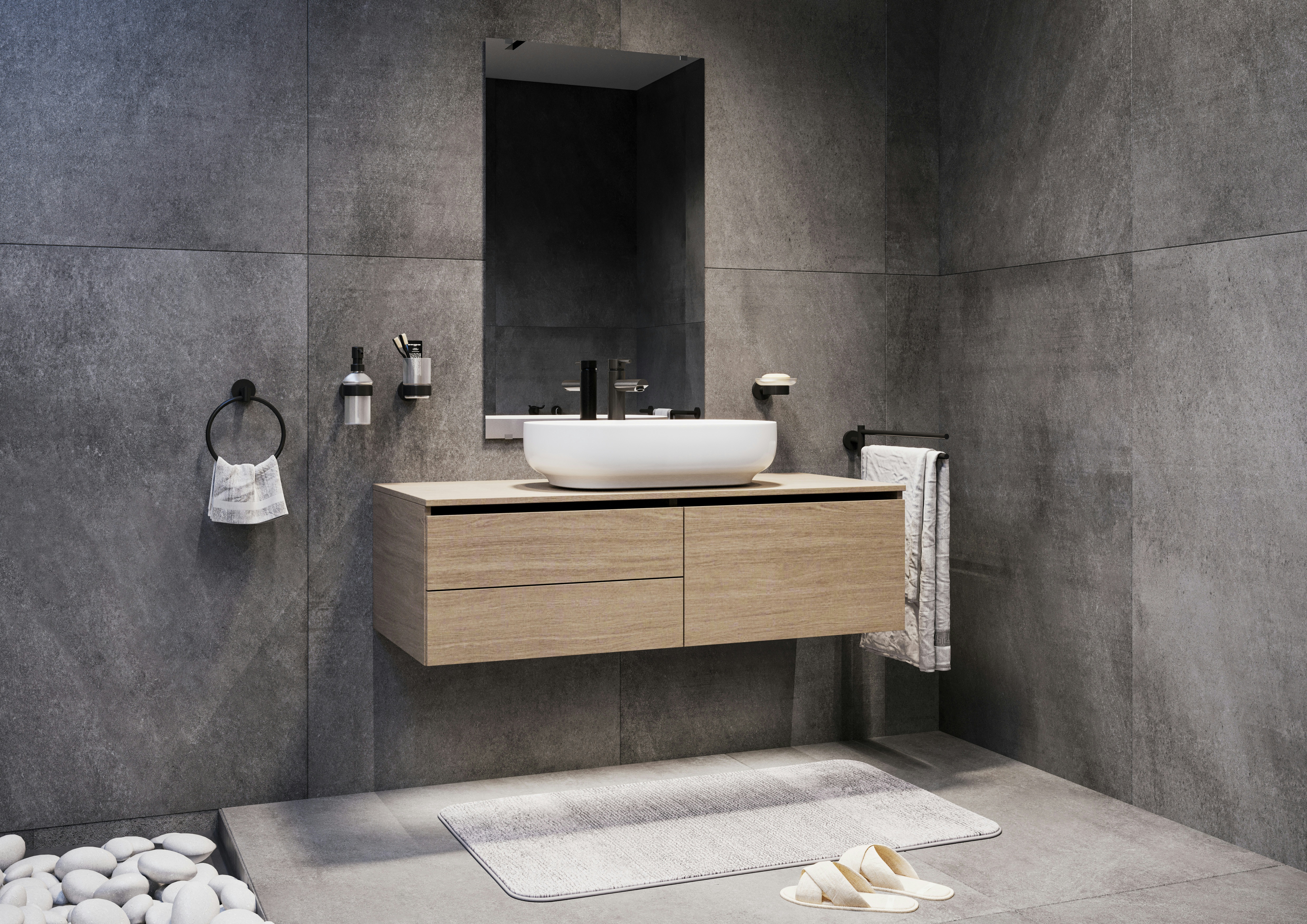 Modulare Fahrradbarriere aus Metall in Schwarz-Grau am urbanen Uferweg, mit Fahrrad-Symbol